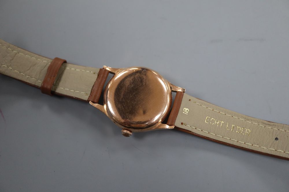 A gentlemans 14k Tissot automatic wrist watch, movement c.28.5.21, on later associated leather strap.